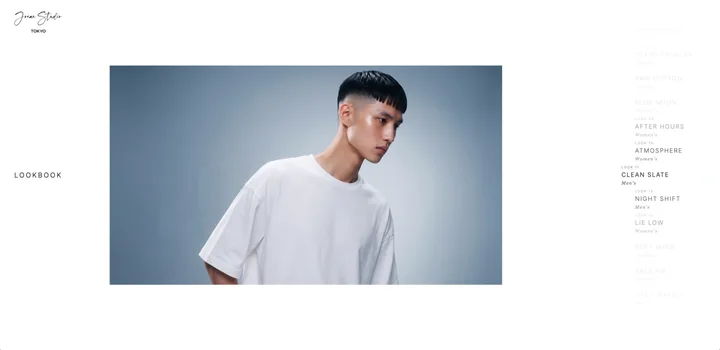 Look 11 “Clean Slate” — oversized white tee against grey-blue, at rest