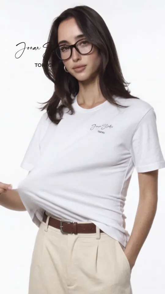 A model in a white Jonan Studio tee and glasses