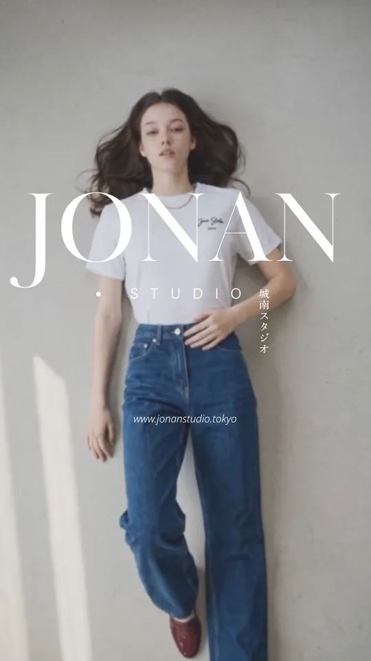 A model in a white tee and jeans — “JONAN STUDIO”