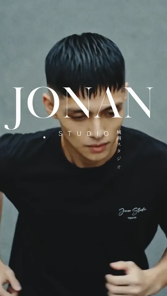A man in a black Jonan Studio tee — “JONAN STUDIO”