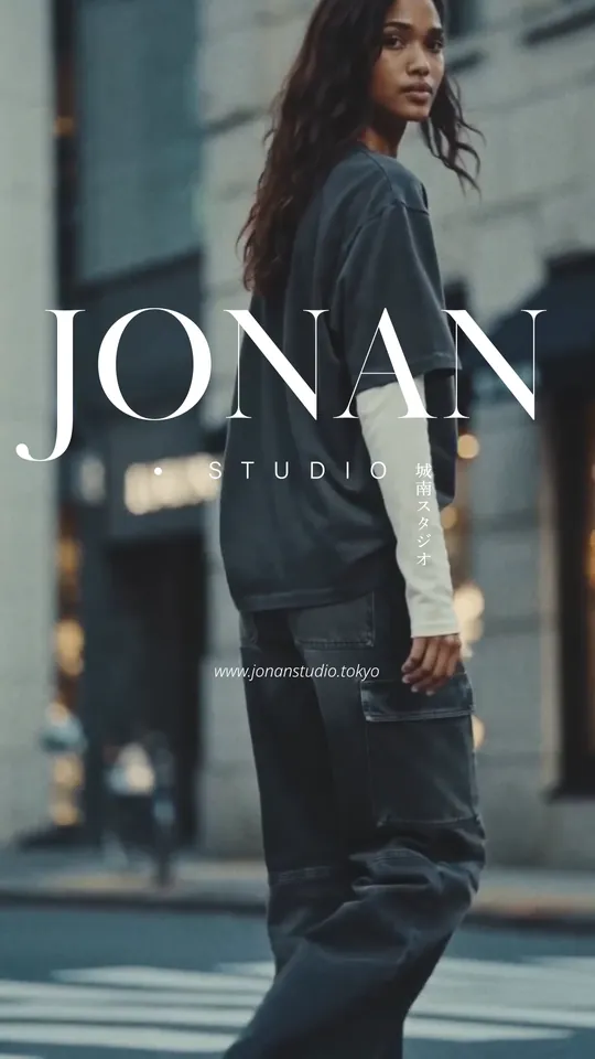 A model looking back on a city street — “JONAN STUDIO”