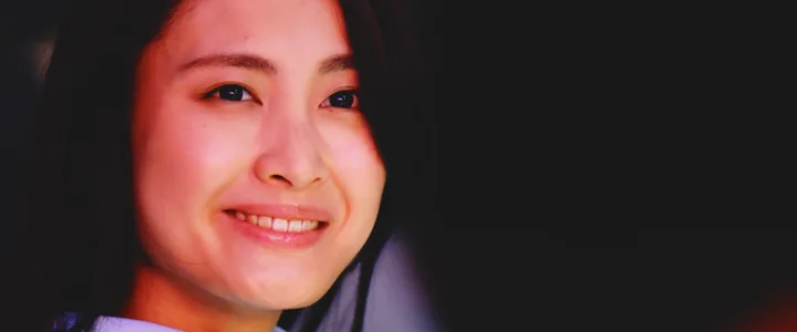 A woman smiling in close-up