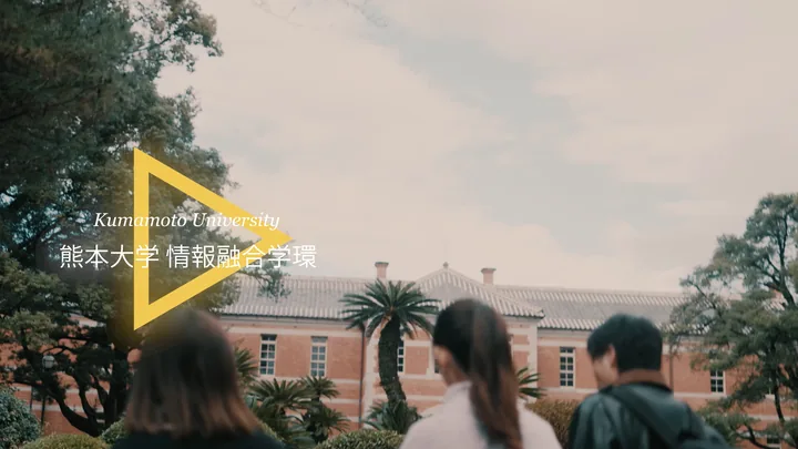 Students walking by the red-brick building, with the logo