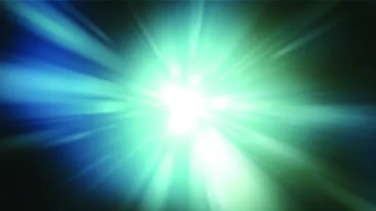 A burst of blue-green light flares from the centre