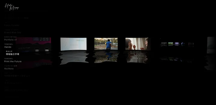 Portfolio v1 — the ring of film cards over the reflective floor