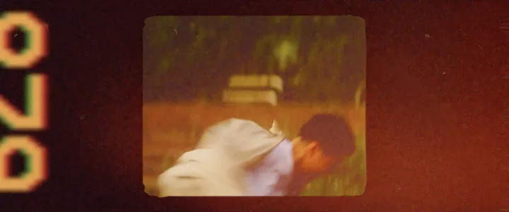 A film frame of a man falling back, with edge numbers burnt in