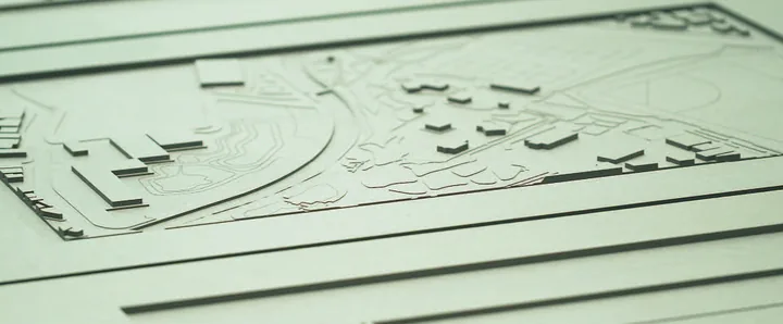 Close-up of a white architectural model of the campus