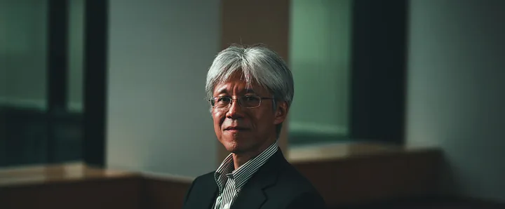 An interviewee smiling in a sunlit room