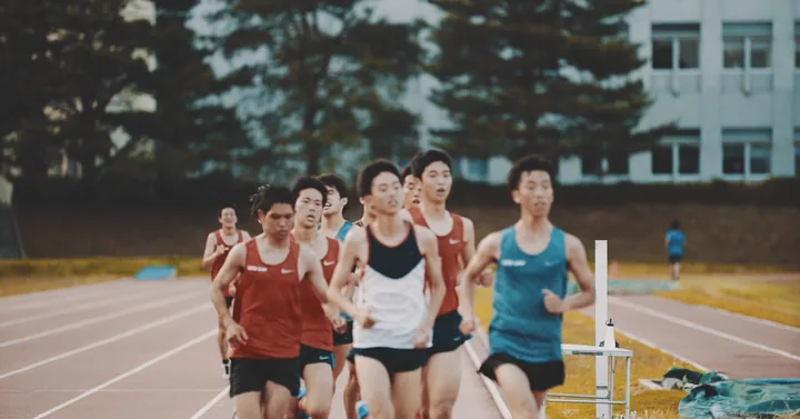 Runners in a pack on a track