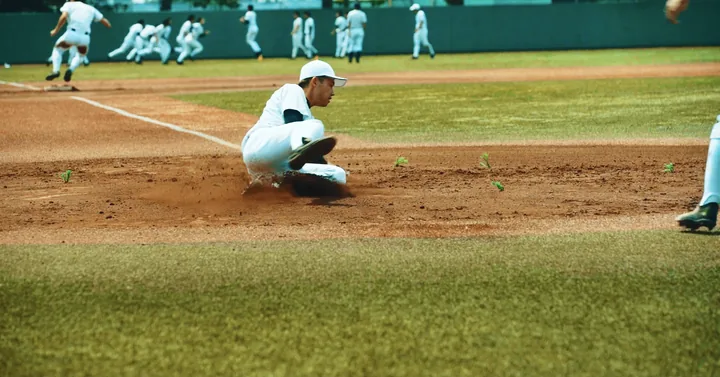 A runner sliding into home plate